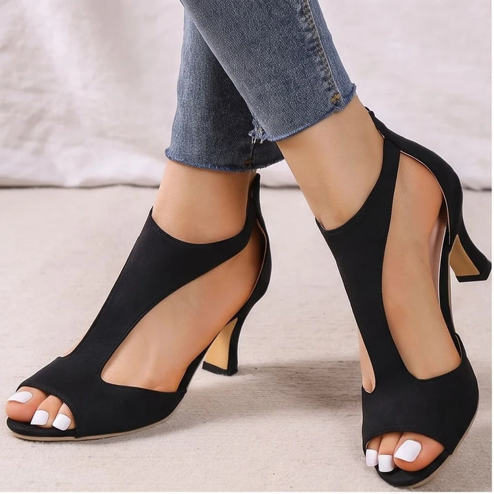 Model wearing Black sandals in a studio
