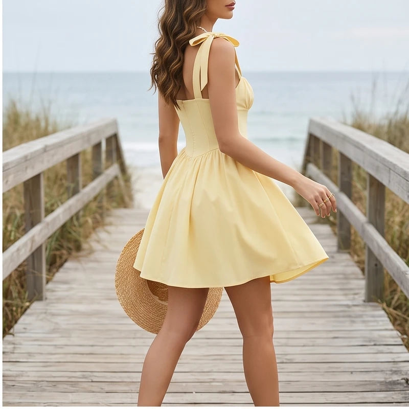 Model wearing L Solara Tie-Strap Yellow Mini Dress outdoors - 2