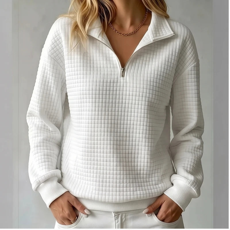 Model wearing Beige knit pullover in a studio