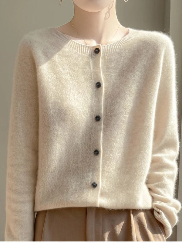 Model wearing Beige wool cardigan in a studio