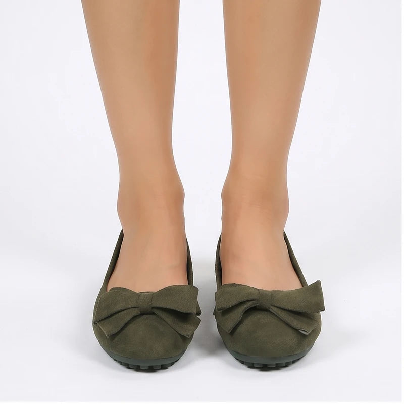 Model wearing Green Briony Suede Bow Flats in studio