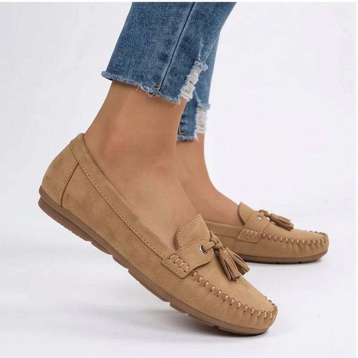 Model wearing Apricot loafers in a studio - 3