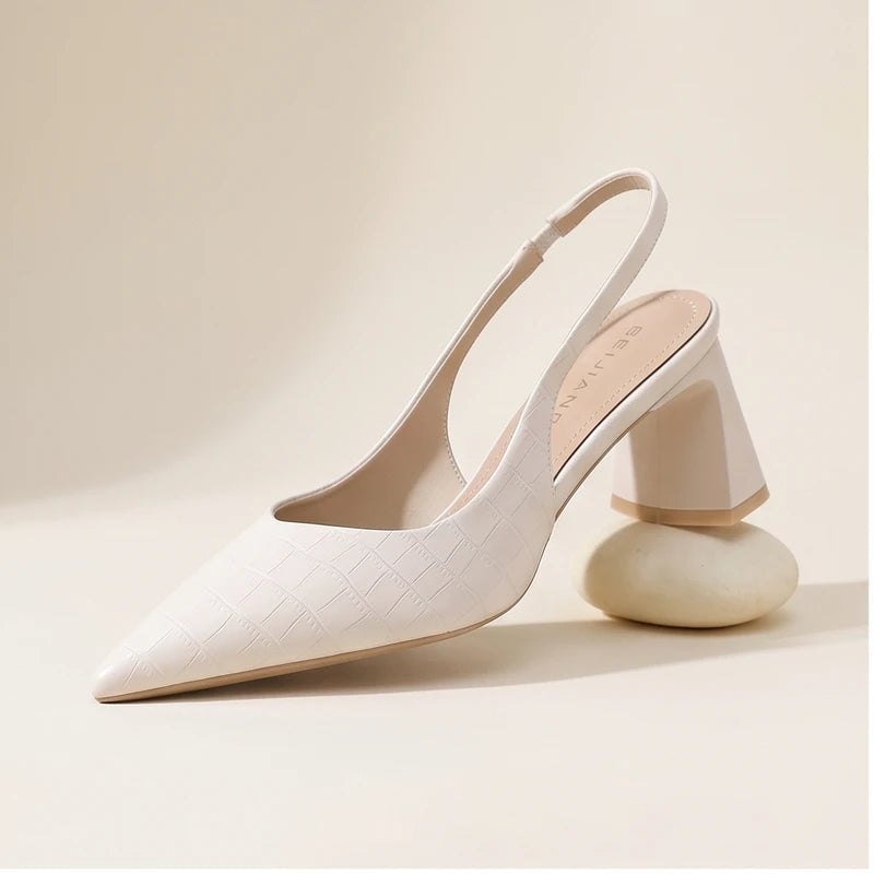 Pink heel in a studio background