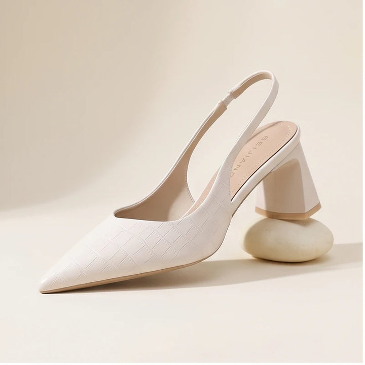 Pink heel in a studio background