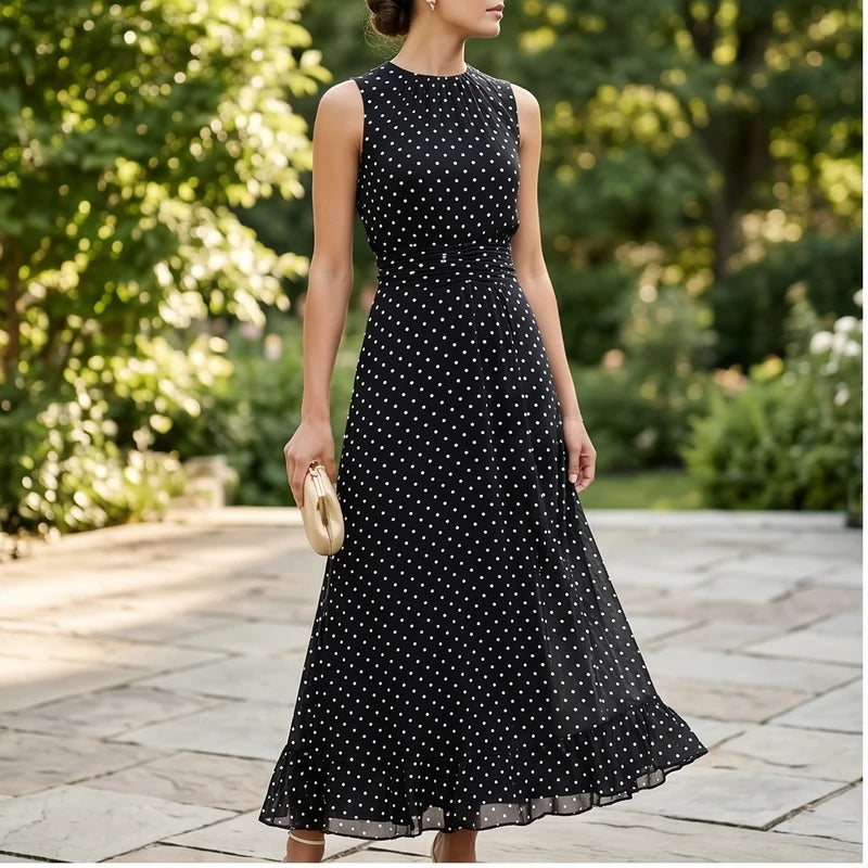 Model wearing Black Sleeveless Polka Dot Chiffon Maxi Dress with Ruffle Hem and Flowing A Line Silhouette for Summer Parties outdoors