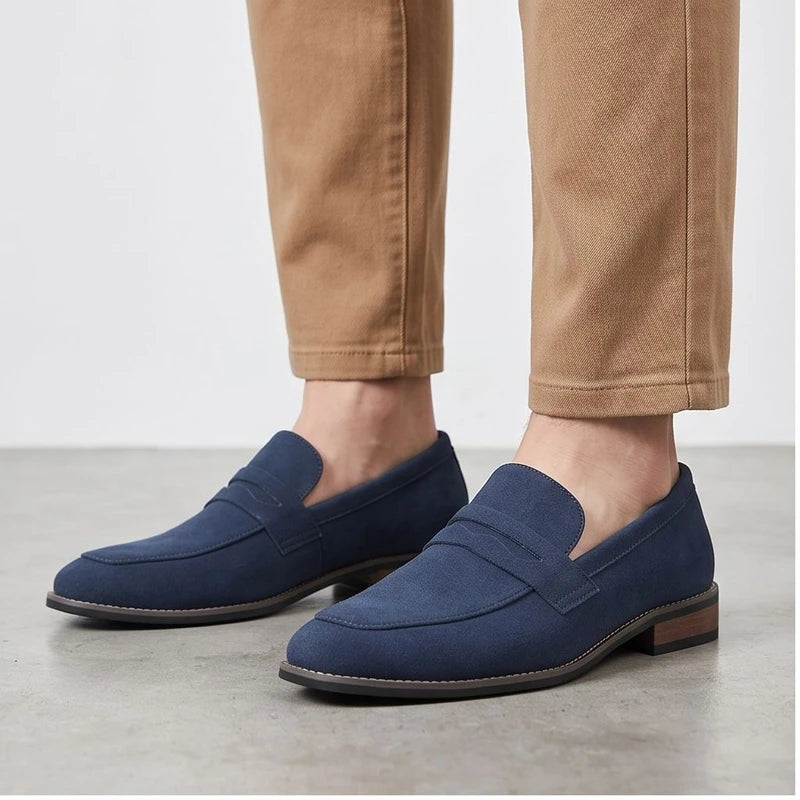 Model wearing Blue suede loafers in a studio
