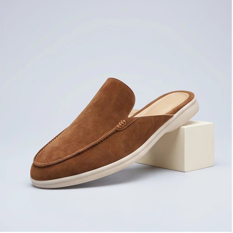 Camel suede mules in a studio background