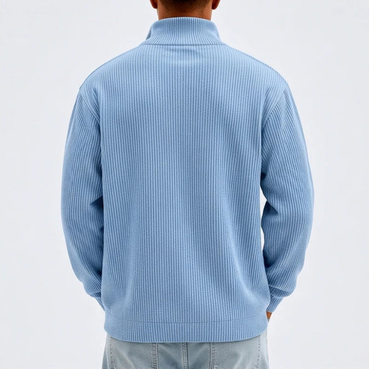 Model wearing Blue corduroy pullover in a studio - 2