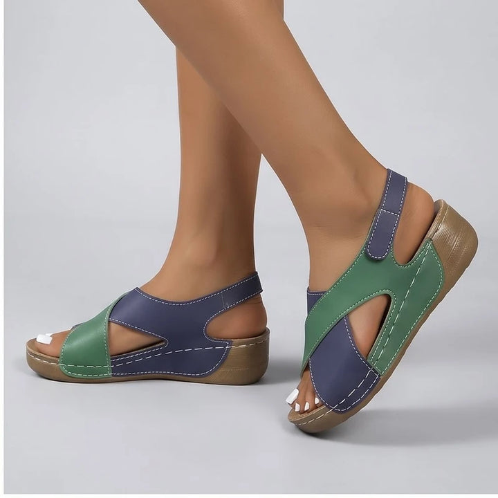 Model wearing Green sandals in a studio
