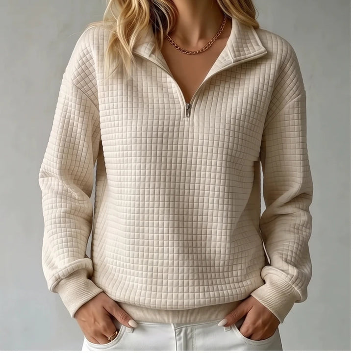 Model wearing Khaki knit pullover in a studio