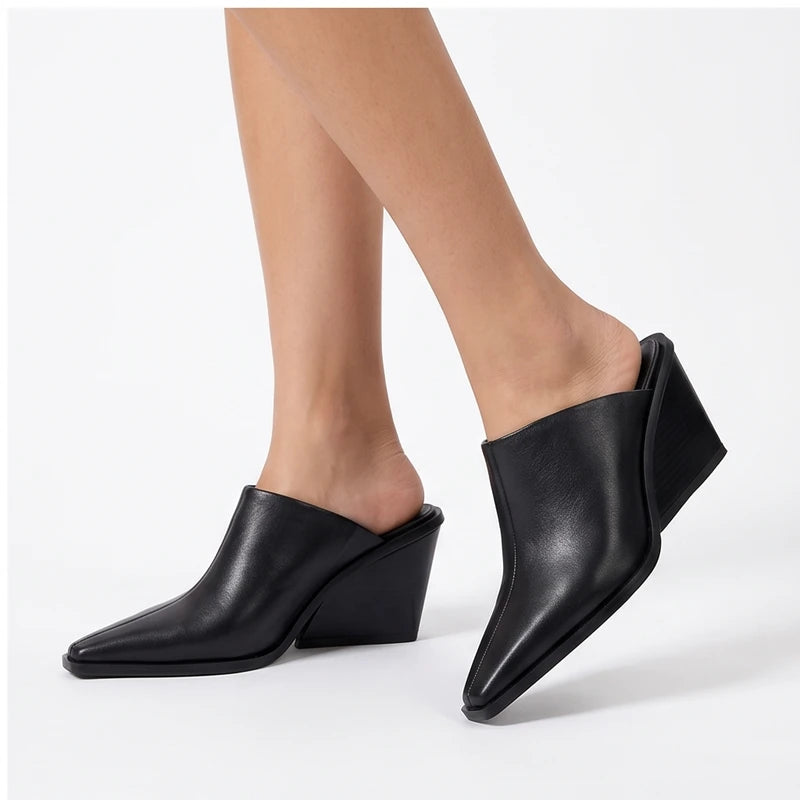 Model wearing Black PU Valdis Genuine Leather Wedge Mules in studio - 4