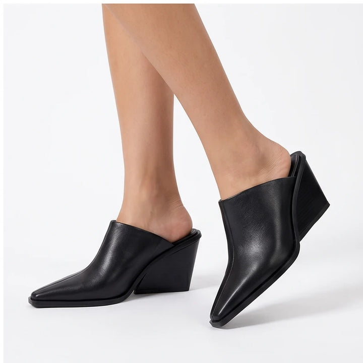 Model wearing Black PU Valdis Genuine Leather Wedge Mules in studio - 4