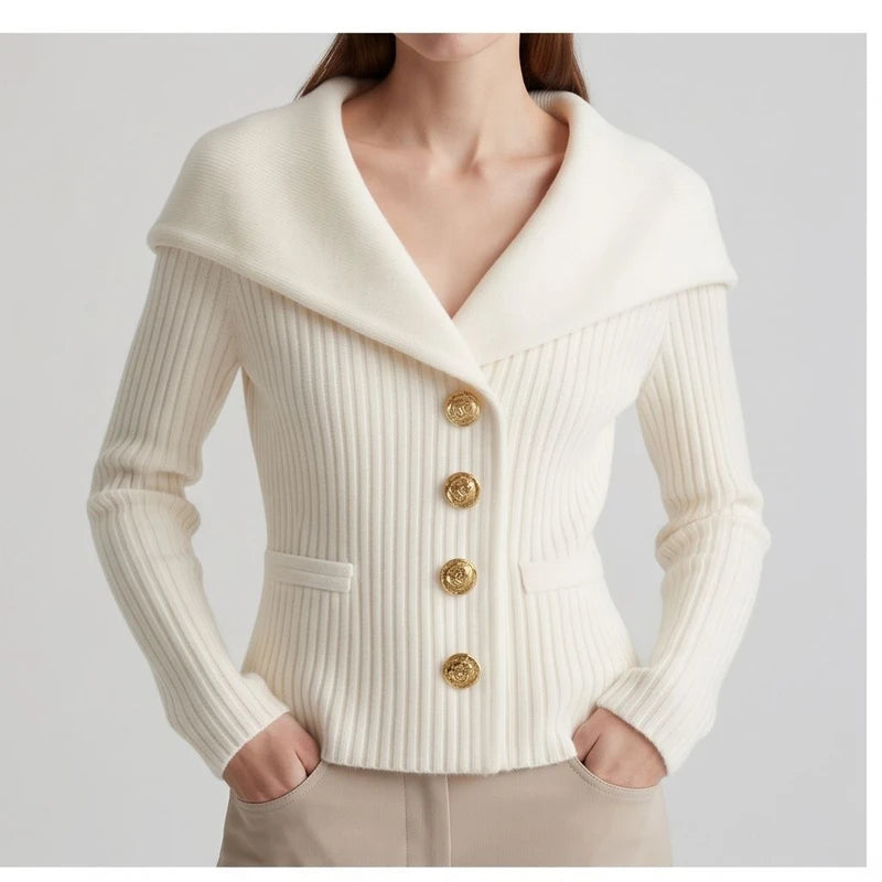 Model wearing white knitted jacket in a studio
