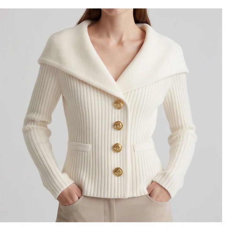 Model wearing white knitted jacket in a studio