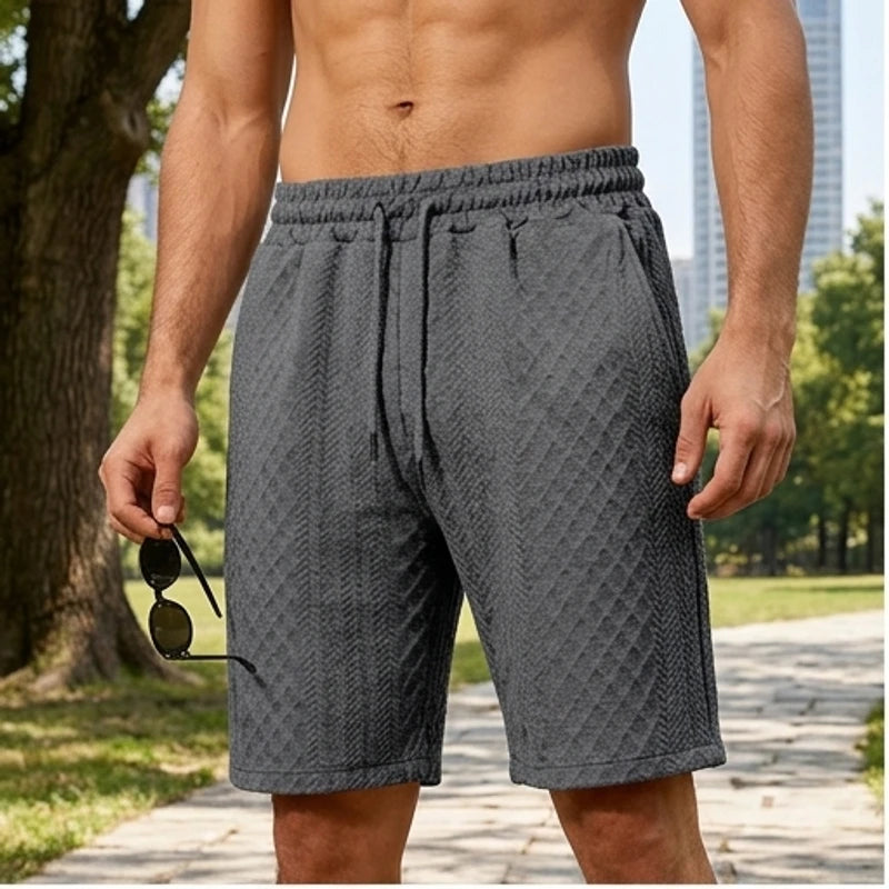 Model wearing Dark Gray 2026 Summer Jacquard Texture Sports Shorts, Trendy Casual Five-point Pants For Men outdoors