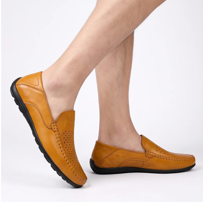 Model wearing Tan leather loafers in a studio - 2