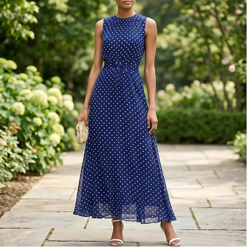 Model wearing Blue Sleeveless Polka Dot Chiffon Maxi Dress with Ruffle Hem and Flowing A Line Silhouette for Summer Parties outdoors