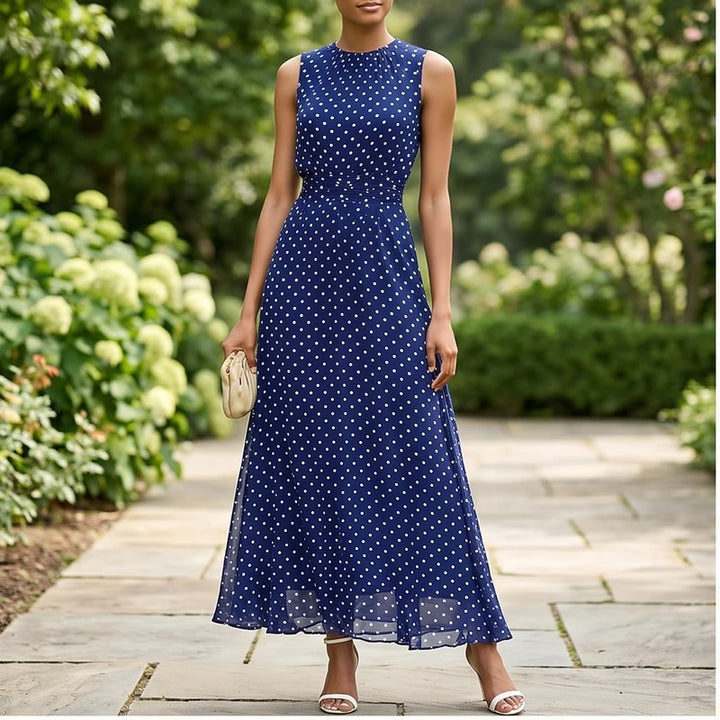 Model wearing Blue Sleeveless Polka Dot Chiffon Maxi Dress with Ruffle Hem and Flowing A Line Silhouette for Summer Parties outdoors