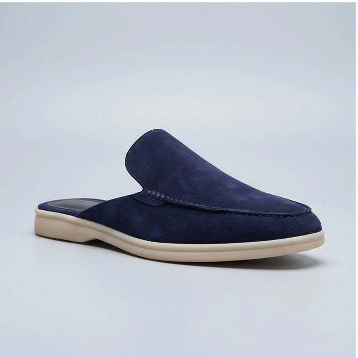 Blue suede mules in a studio background - 3