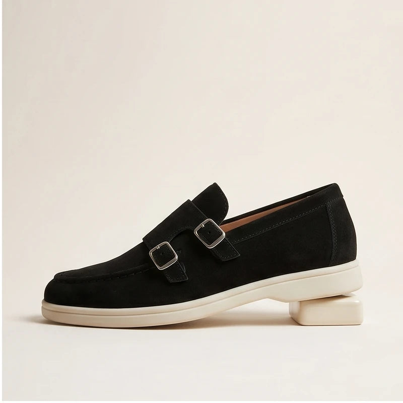 Black suede double monk strap loafers with silver buckles.