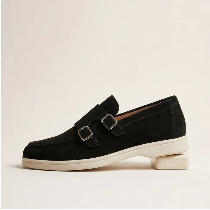 Black suede double monk strap loafers with silver buckles.