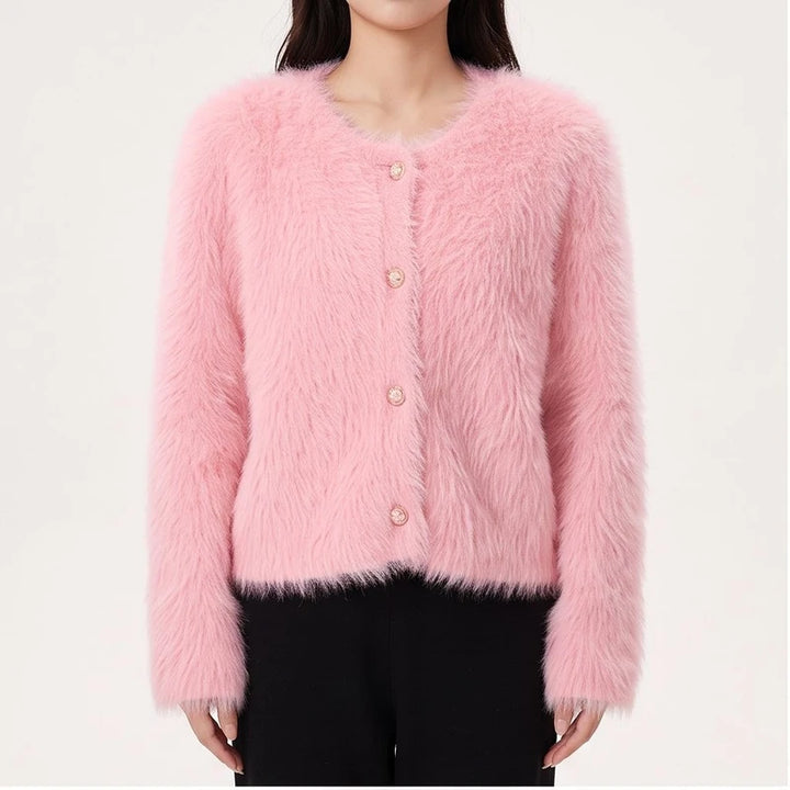 Model wearing Pink cashmere cardigan in a studio