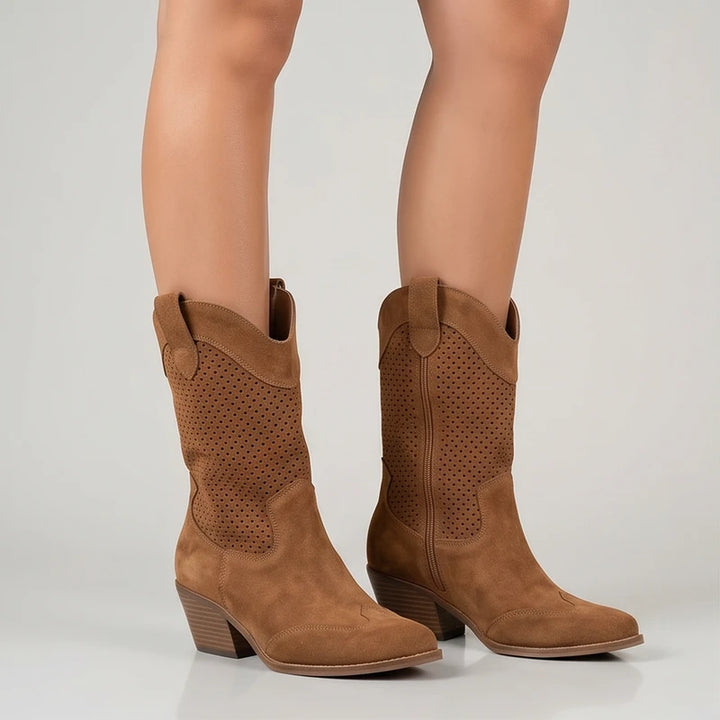 Model wearing Brown Gideon Suede Western Ankle Boots in studio