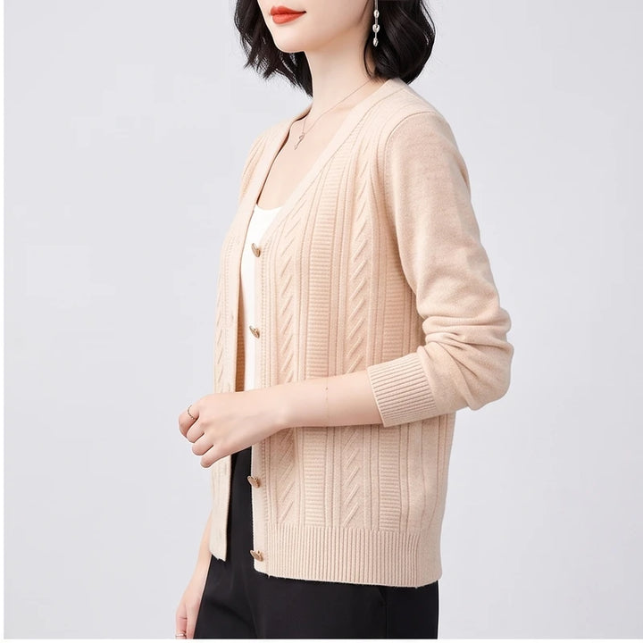 Model wearing apricot knitted cardigan in a studio - 2