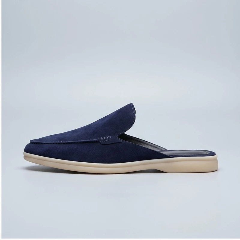 Blue suede mules in a studio background - 2