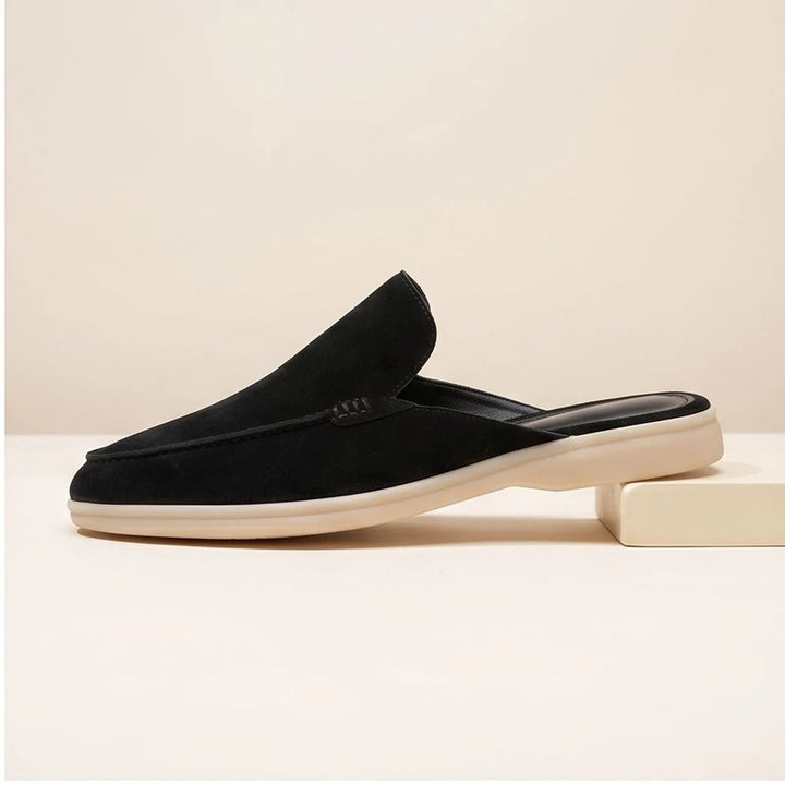 Black suede mules in a studio background - 2
