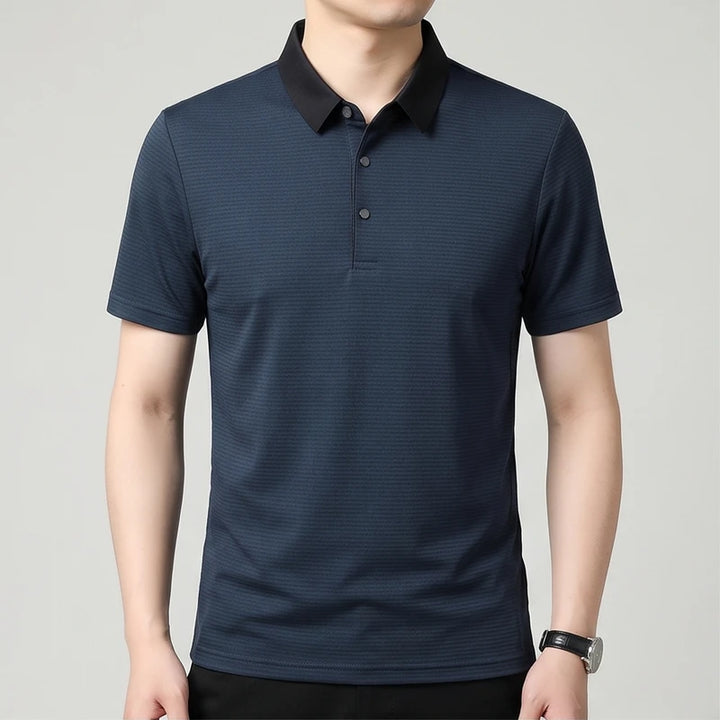 Model wearing Navy Hollis Striped Polo in studio