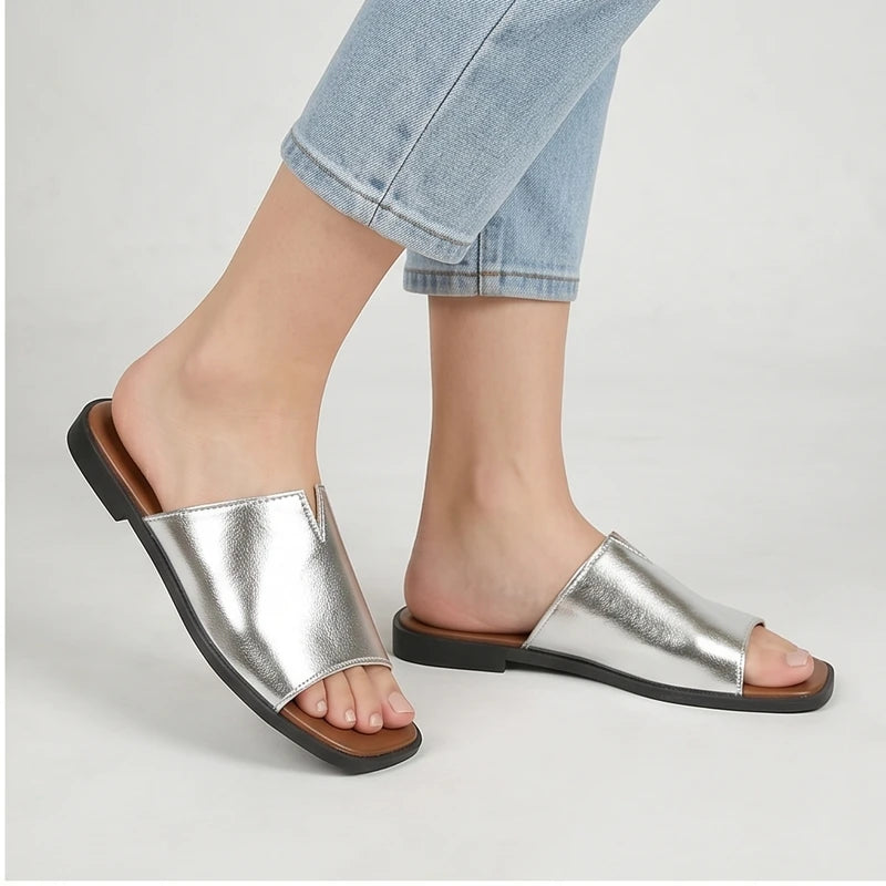 Model wearing Silver Shiny Metallic Flat Slides for Women Square Toe Open Toe Lightweight Comfortable Summer Beach Casual Daily Walking Shoes in studio - 2