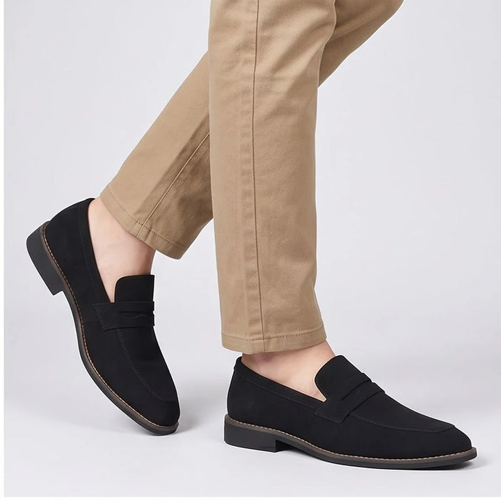 Model wearing Black suede loafers in a studio - 2