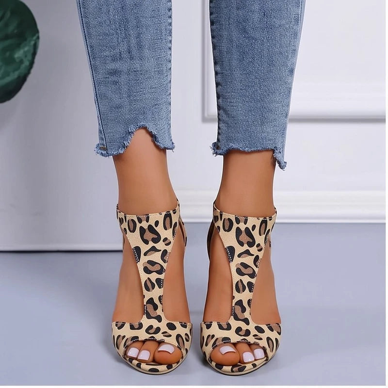 Model wearing Leopard sandals in a studio