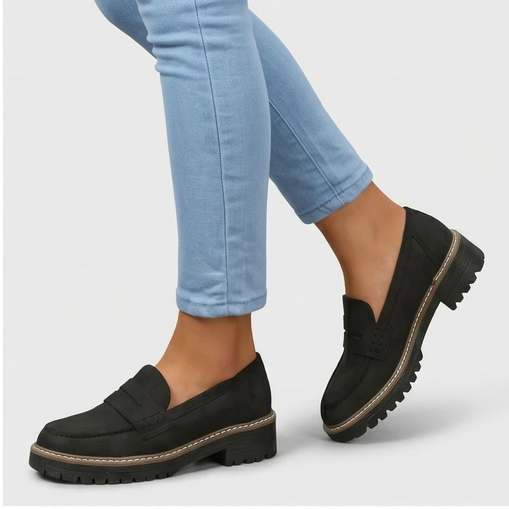 Model wearing Black Brynn Suede Penny Loafers  [needs new images] in studio