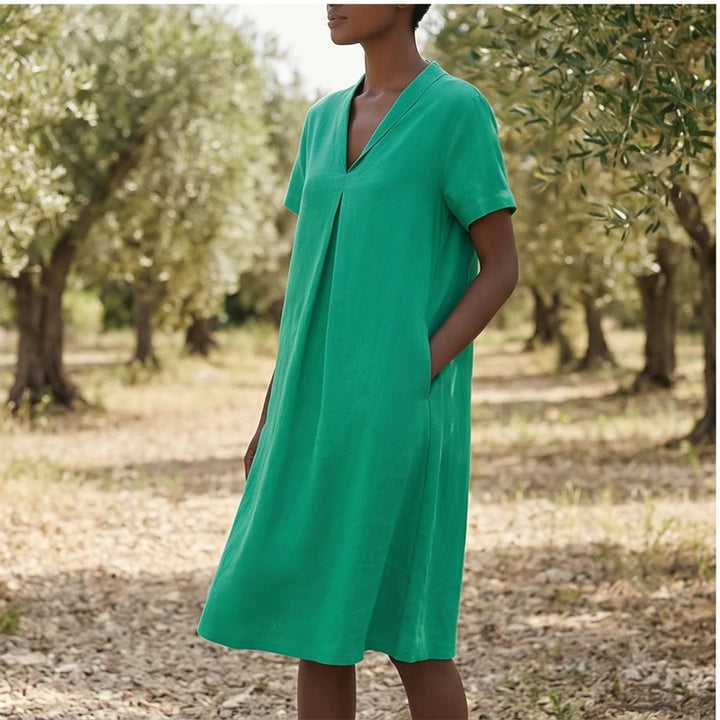 Model wearing Green Women's Short-sleeved Cotton and Linen Dress V-neck Loose Large Size Casual Vacation Street Long Dress with Pockets outdoors - 3