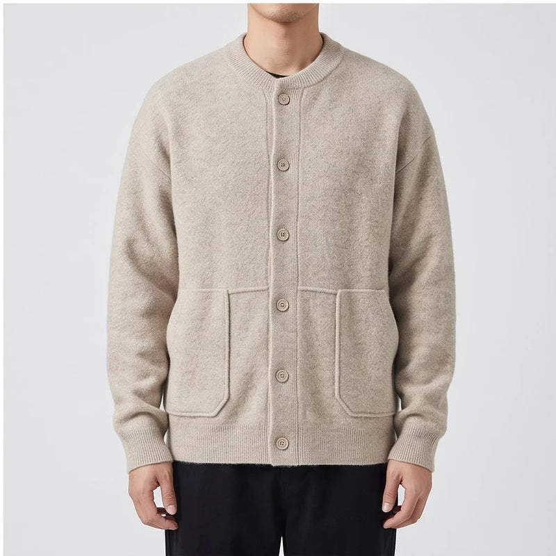 Model wearing Ivory knitted cardigan in a studio - 2