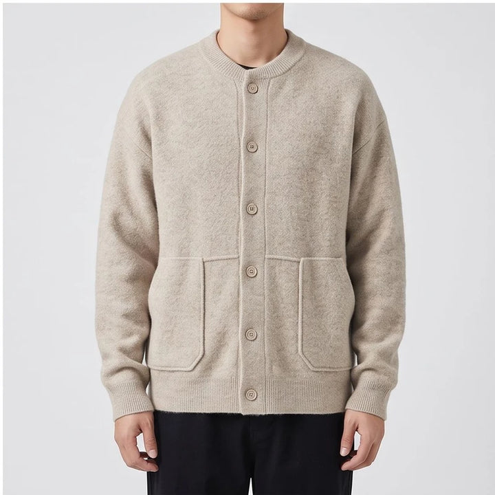 Model wearing Ivory knitted cardigan in a studio - 2