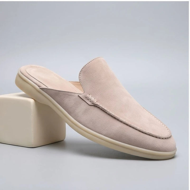 White suede mules in a studio background - 3