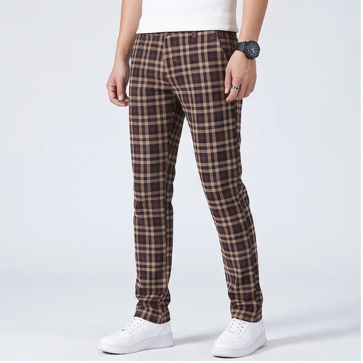 Model wearing Dark khaki cotton pants in a studio