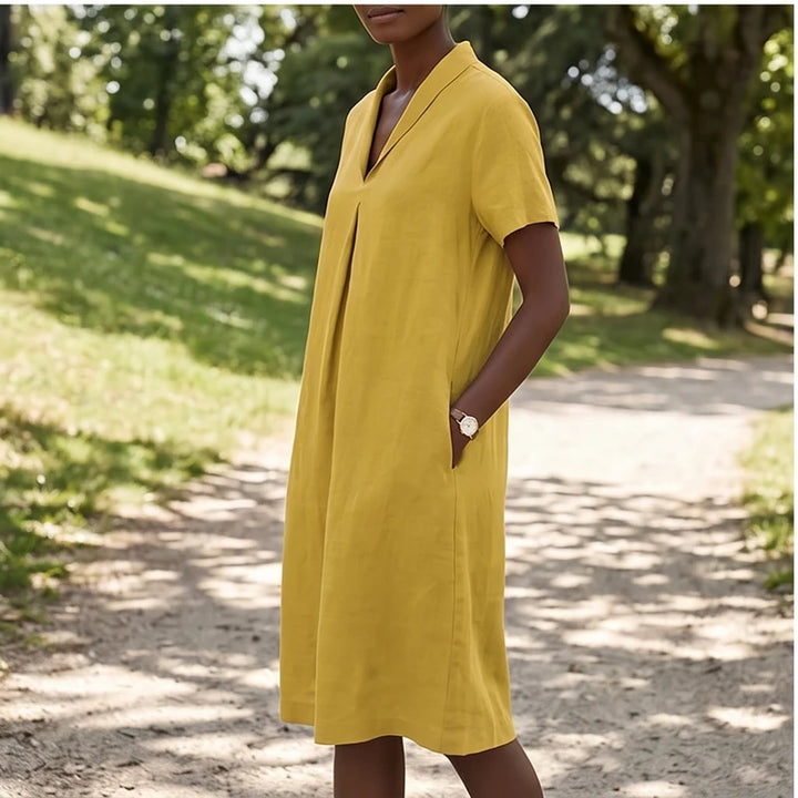 Model wearing Yellow Women's Short-sleeved Cotton and Linen Dress V-neck Loose Large Size Casual Vacation Street Long Dress with Pockets outdoors - 3