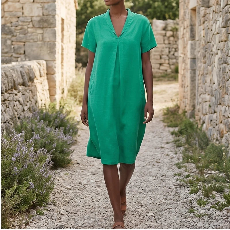 Model wearing Green Women's Short-sleeved Cotton and Linen Dress V-neck Loose Large Size Casual Vacation Street Long Dress with Pockets outdoors - 2