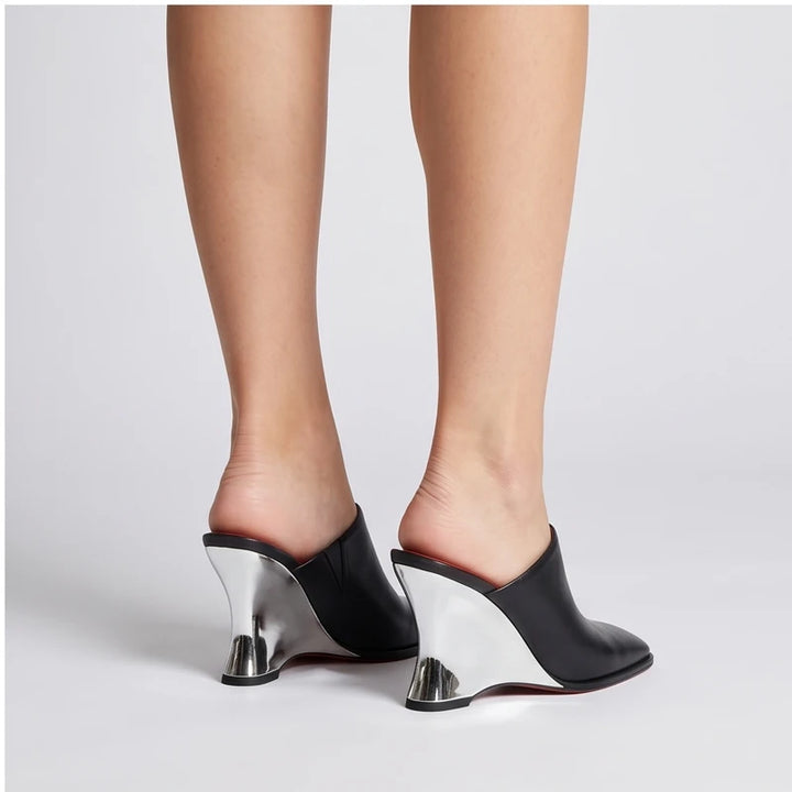 Model wearing Black Olympia Genuine Cowhide Leather Heeled Mules in studio - 4