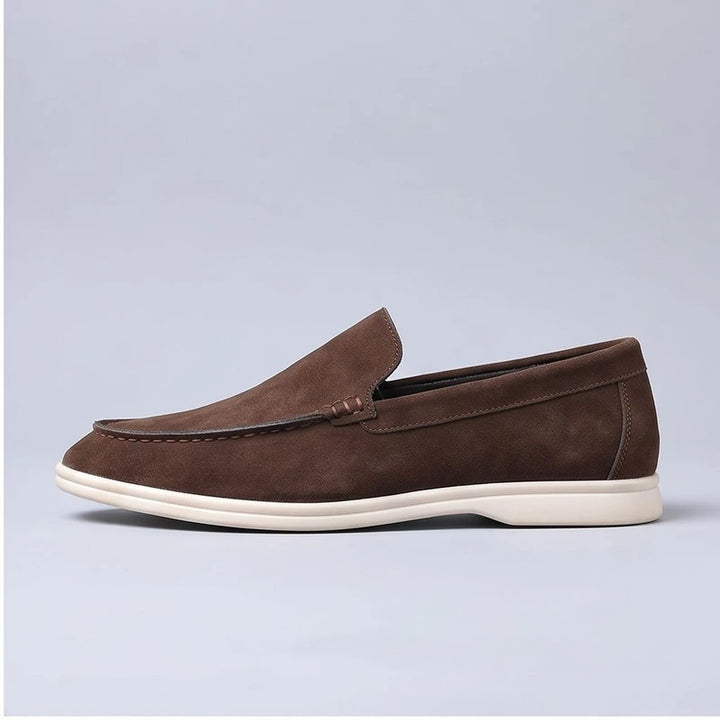 brown suede loafers in a studio background - 2