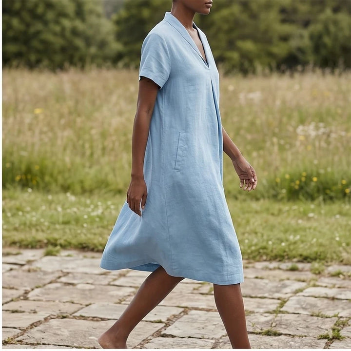 Model wearing Blue Women's Short-sleeved Cotton and Linen Dress V-neck Loose Large Size Casual Vacation Street Long Dress with Pockets outdoors - 2