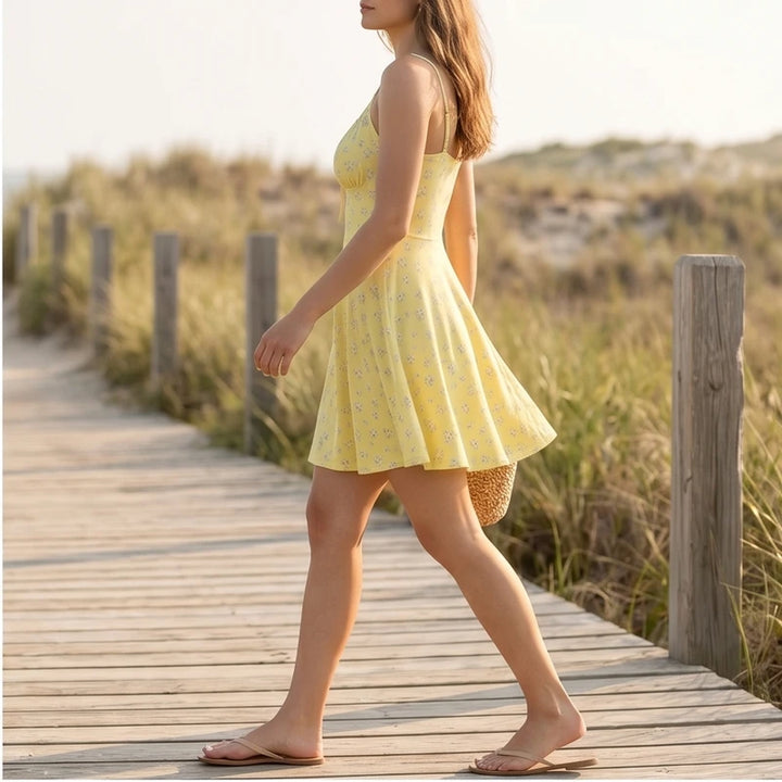 Model wearing Yellow Wren Floral Cami Mini Sundress outdoors - 2
