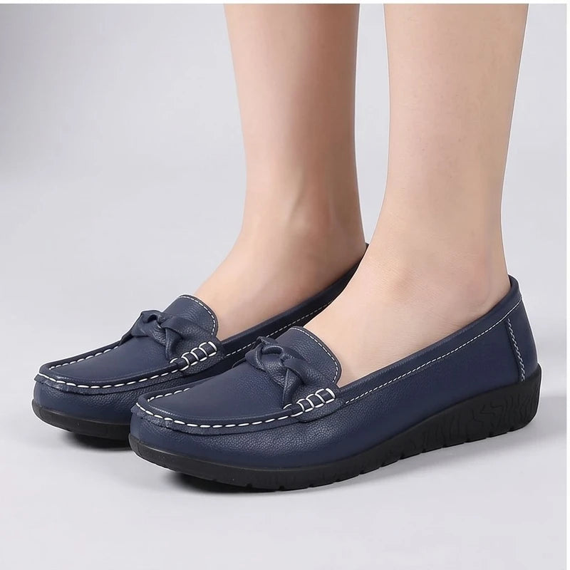 Model wearing NavyBlue leather flats in a studio - 3