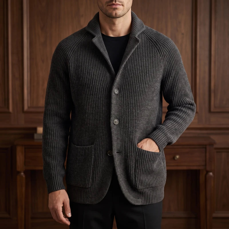 Black knit cardigan in a dark wood interior