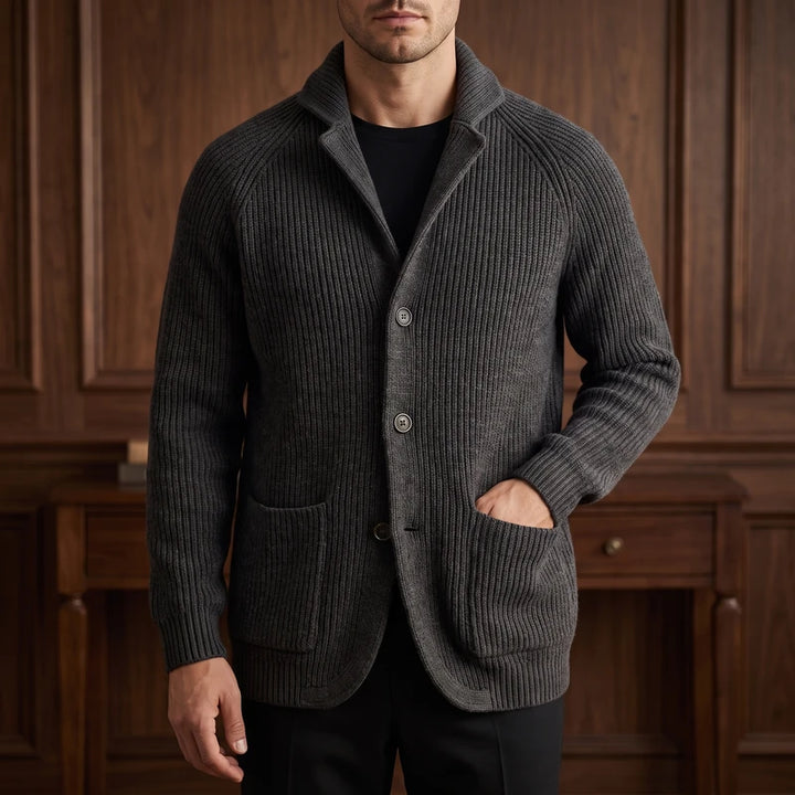 Black knit cardigan in a dark wood interior