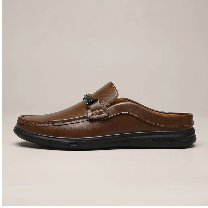 Brown leather mules in a studio background - 2